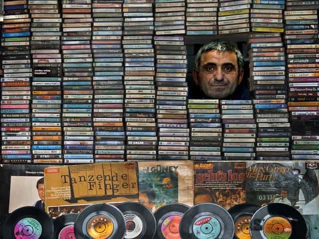 [Music Collector]. Ahmet is a record seller who loves music very much. He has a small and charming shop and he makes collection of long-play records. He spends his life on music and its changes, and he is very happy with the old melodies. Location: Degirmendere, Kocaeli. (Photo and caption by Melih Sular/National Geographic Traveler Photo Contest)