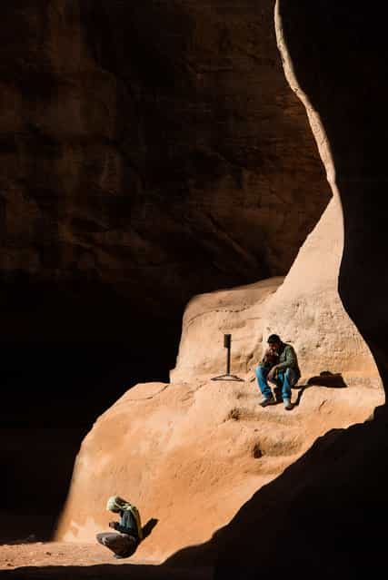 [Resting]. A couple of Beduins are just resting in a ray of the Sun in the Siq, the canyon leading to Petra City in Jordan. (Photo and caption by Jeremie Noel/National Geographic Traveler Photo Contest)