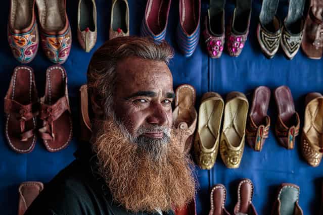 [Shoes Seller]. Portrait of a shoes seller in the city of Jaipur. Location: Jaipur, Rajasthan, India. (Photo and caption by Massimiliano De Santis/National Geographic Traveler Photo Contest)