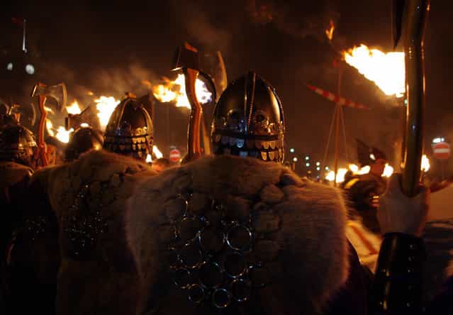 [Vikings at Up Helly Aa]. Local men brave the rain and cold to celebrate Up Helly Aa, the Viking Fire Festival, in the Shetland Island. Location: Lerwick, Scotland. (Photo and caption by Lisa Turner/National Geographic Traveler Photo Contest)