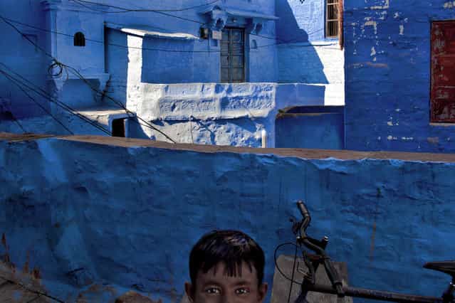 [Surprise]. A child by surprise, is captured during shooting of a part of the old city (Sun City) of Jodhpur (Rajasthan, India). (Photo and caption by Bruno Tamiozzo/National Geographic Traveler Photo Contest)
