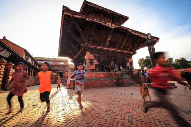 [Nepal, Keeping Running]. One, Two, Three, Let's Go... Location: Bhaktapur, Nepal. (Photo and caption by Mac Kwan/National Geographic Traveler Photo Contest)
