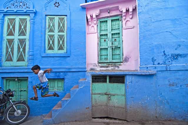 [The Joy!] The boy was so happy jumping on the streets of Jodhpur, India. The moment made me happy and clicked right away. (Photo and caption by Sudharshun Gopalan/National Geographic Traveler Photo Contest)