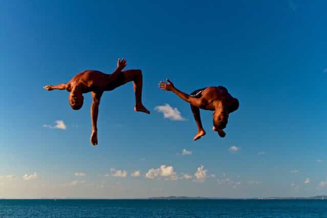 [Free!] Boys have fun jumping in the waters of the Bay of All Saints. Salvador, Bahia, Brazil. (Photo and caption by Marcio Pimenta/National Geographic Traveler Photo Contest)