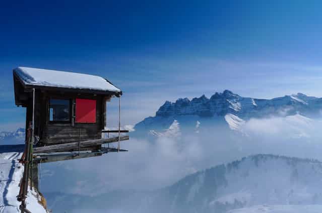 [Living on the Edge]. It was a Saturday in February 2012. I took this photo at the top of the chairlift of the Pointe de l'Au in the ski area of ​​Les Portes du Soleil, Switzerland. In the background, the Les Dents du Midi. (Photo and caption by Florin Biscu/National Geographic Traveler Photo Contest)