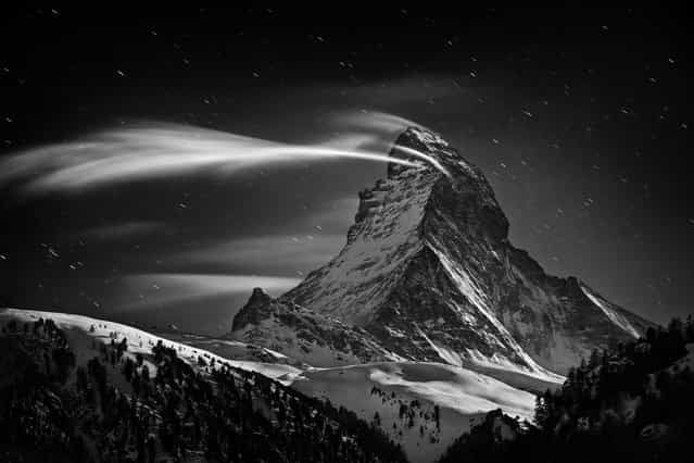 [Matterhorn: Night Clouds]. The Matterhorn 4478 m at full moon. Location: Zermatt, Switzerland. (Photo and caption by Nenad Saljic/National Geographic Traveler Photo Contest)