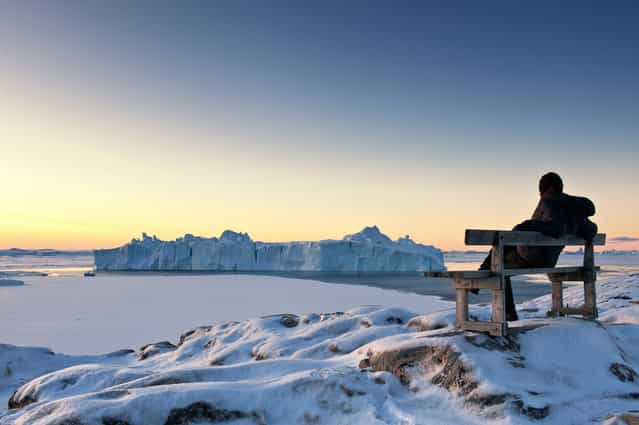 [Arctic dawn]. While gazing at colossal icebergs, I greeted the Artcic Circle mid-winter dawn.(10:17a.m.). Location: Ilulissat, Greenland. (Photo and caption by Takaki Watanabe/National Geographic Traveler Photo Contest)