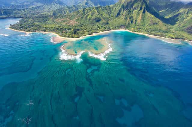 [Tunnels Beach]. The protective coral reef that makes Tunnels Beach a great place for beginners to snorkel & scuba dive can be seen from the air. The beach is located on the island of Kaua'i, Hawai'i. (Photo and caption by Scott Chapman/National Geographic Traveler Photo Contest)