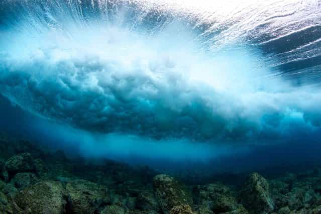 These incredible images capture the immense detail of waves beautifully crashing into the serene waters of Hawaii. (Photo by Bryce Groark/Caters)