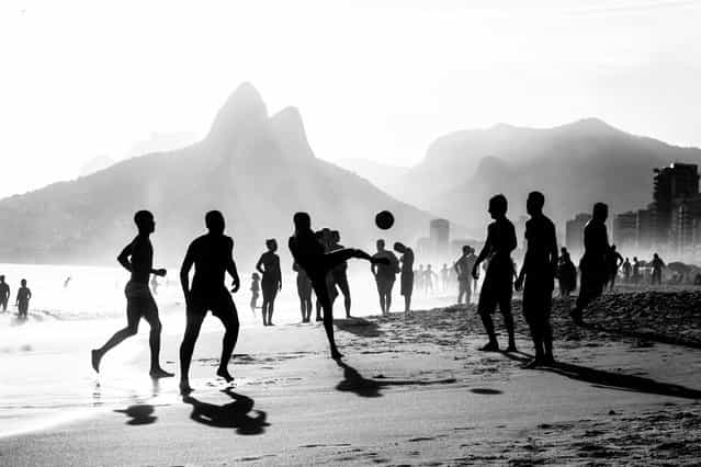 [The Beautiful game]. Rio: Ipanema, zamba, capirinhas and Soccer this are a few words to describe one of the most exotic, and beautiful cities, Rio De Janeiro where Cariocas (locals) take advantage of the beauty that nature gave them, and play sports on the beach like soccer, where passion for the beautiful game makes them one of the best. (Photo and caption by Julio Campos/National Geographic Traveler Photo Contest)