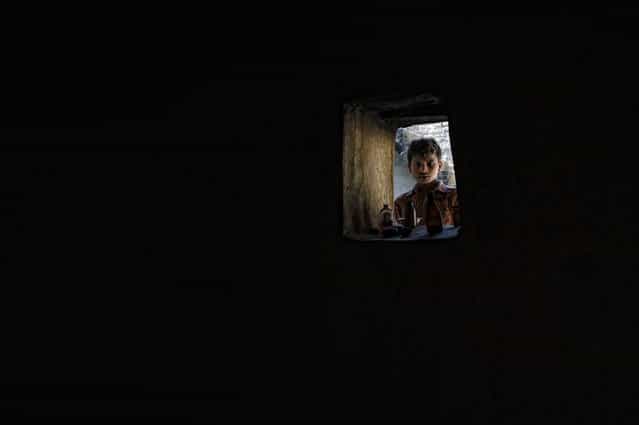 [Black magic]. From the inside of the bothie in a village. Location: India. (Photo and caption by Guido Sperzaga/National Geographic Traveler Photo Contest)