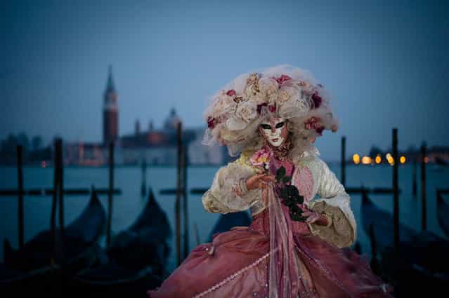 [Carnevale di Venezia]. Each year, the Carneval in Venice is celebrated prior to lent. History depicts a celebration whereby revellers would enjoy several weeks of partying to rid their pantry of meat prior to 40 days of fasting. Today the traditions continue with street parties, balls and events whereby revellers dress in a costume and mask. The City of Venice puts on a grand show of events and activities, including masked and costumed folk who willingly pose for the camera in the most scenic of backgrounds. (Photo and caption by Lidia D'Opera/National Geographic Traveler Photo Contest)