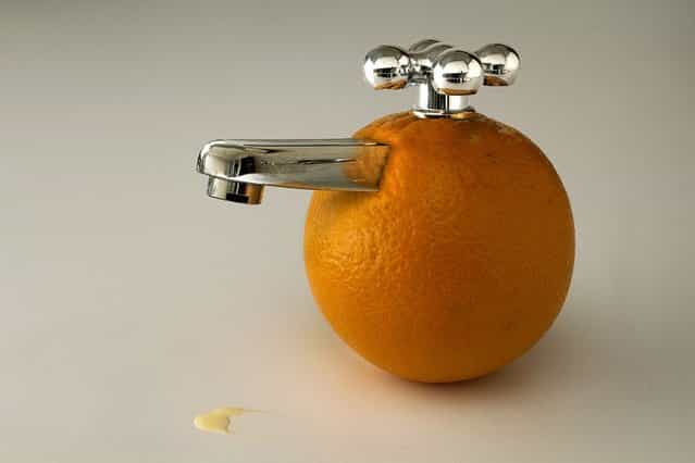An orange with a faucet. (Photo by Giuseppe Colarusso/Caters News)