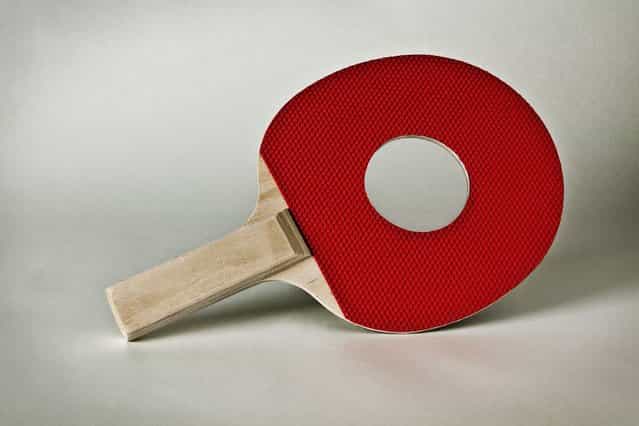 A ping pong paddle with a hole in it. (Photo by Giuseppe Colarusso/Caters News)