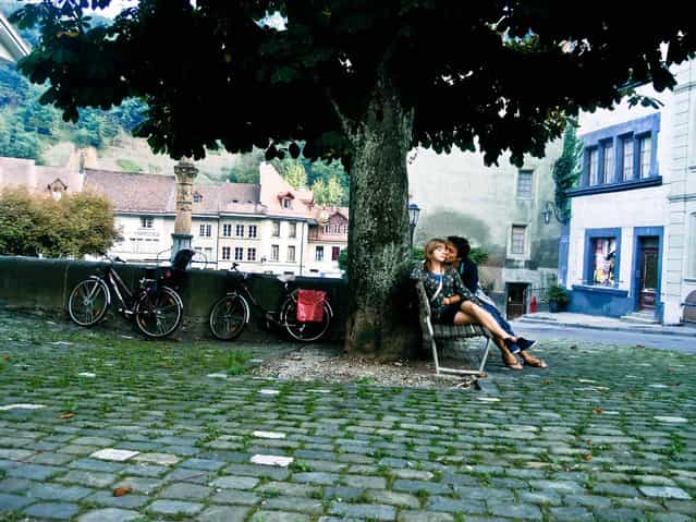 [A Date in Fairytale Town]. A romantic couple enjoying the peace and calmness of the fairytale town of Fribourg. Location: Fribourg, Switzerland. (Photo and caption by Erol Can Ün/National Geographic Traveler Photo Contest)
