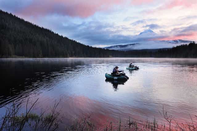 [Fishing at sunrise]. Early morning at Trillium lake, Oregon, the sun had not fully come out yet, but these two folks had already launched their boats for fishing. It was quite a lot of fun to watch them chatting and casting the line, especially with the morning colors and mist. (Photo and caption by Victor Liu/National Geographic Traveler Photo Contest)