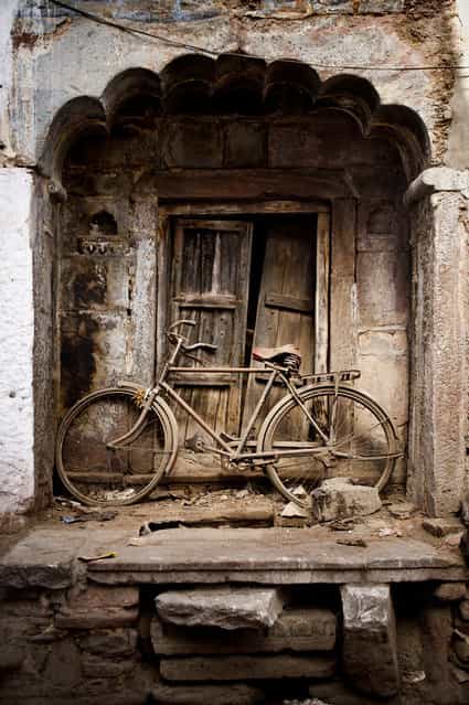 [Throwed-away bicycle]. Throughed-away bicycle. Location: India. (Photo and caption by Tang Wing Kit/National Geographic Traveler Photo Contest)