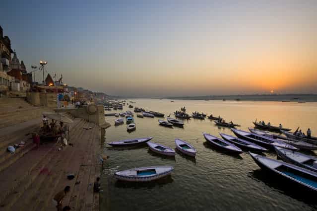 [Sunrise at Ganges River]. The Ganges is the most sacred river to Hindus and Varanasi is a city situated on the banks of the Ganges River. It is regarded as a holy city by Hindus and one of the oldest continuously inhabited cities in the world. (Photo and caption by Ng Hock How/National Geographic Traveler Photo Contest)