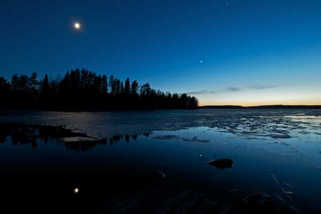 [Cold Truth of Finland]. Got this one captured on 28.4.2012 around 02.00am outside my summerhouse. 2 days before we could walk on ice to the island where my summerhouse is and 2 days after the shot we were going back to mainland with rowing boat. The view in the night was just so amazing, cold bright sky, moon, stars and a little bit sunset in the back as a bonus. Nightless nights here are just amazing. Location: Ylöjärvi, Pengonpohja, Finland. (Photo and caption by Tommi Blom/National Geographic Traveler Photo Contest)