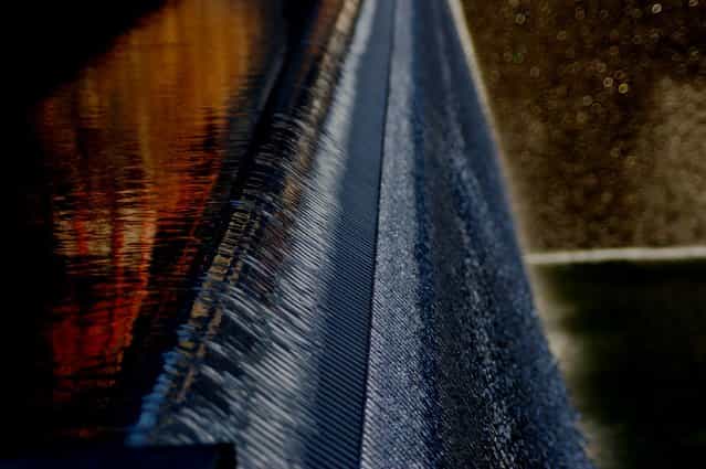 [Water Fall at the WTC Center Memorial]. The World Trade Center Memorial in New York City seemed vast and somewhat sterile until I focused on just a part of the waterfall and was overwhelmed with the feeling of all those fleeting souls coursing down into the abyss. (Photo and caption by Joan Stiehl/National Geographic Traveler Photo Contest)