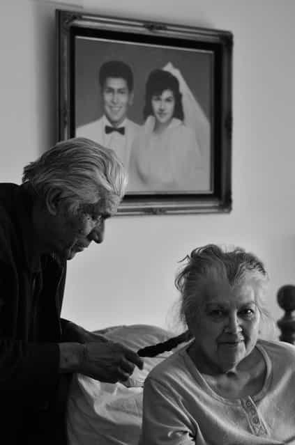 [Her Last Days]. My family and I were visiting my grandparents so they could see my sister's newborn for the first time. While I was in the living room my dad called me into their room really quick to take a picture of my grandpa doing my grandma's hair before I missed it. It wasn't until I was about to take the picture when I noticed their wedding picture(painting) in the background, so I stepped back to fit it in and it came out great. This picture was taken on February 12, 2012 and she passed away April 12, 2012. My grandparents were married a little over 50 years. Location: Los Angeles, CA. (Photo and caption by Paul Mora/National Geographic Traveler Photo Contest)
