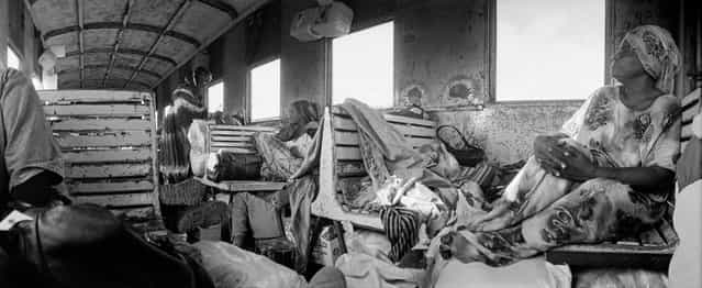 [The third class saloon]. It was on the ethiopian train. The railroad line connected Addis Abeba, the capital of Etiopia, in Djibouti (far from 850 kms). Unfortunately, the railways company went bankrupt last year... No more train on the line. (Photo and caption by Pierre Javelot/National Geographic Traveler Photo Contest)