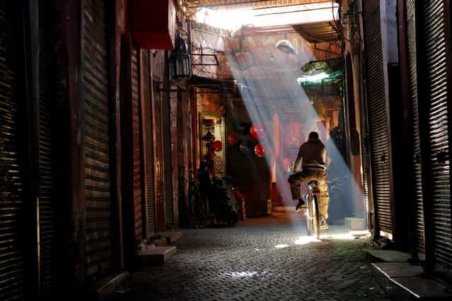 [Marrakech Traveler]. It was mid-morning and he must have wanted to ride into the light. I was shooting for the ABC TV show Born to Explore when I snapped this photo. Location: Marrakech, Morocco. (Photo and caption by John Barnhardt/National Geographic Traveler Photo Contest)