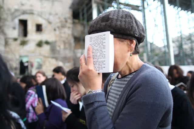 [Women's Prayer]. This was my first time seeing many women from the youngest to the oldest praying seriously with all of their heart and mind. Location: The Western Wall in the midst of the Old City in Jerusalem. (Photo and caption by Lydia Isnanto/National Geographic Traveler Photo Contest)