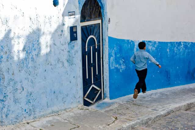 [The Running Boy]. A young boy is [flying] home. Location: Rabat Kasbah, Morocco. (Photo and caption by Pietro Sferrino/National Geographic Traveler Photo Contest)