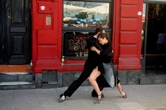 [Dancing in the Street]. Tango performers demonstrate the art of the dance in La Boca, Buenos Aires, Argentina. (Photo and caption by Scott Sleek/National Geographic Traveler Photo Contest)