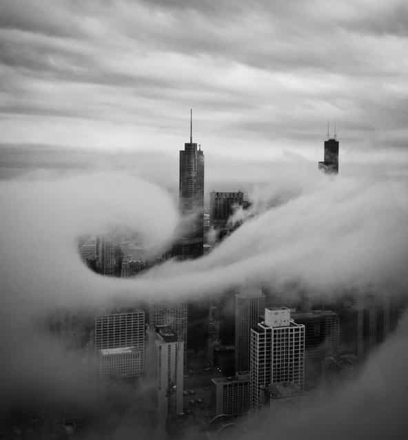[Swirl]. This was taken on 95th floor of John Hancock Building. I was fortunate to watch fast moving low hanging clouds swept through the city buildings during late afternoon. A cloud swirled around the Trump Tower for a very brief moment for me to capture two frames. This is one of the two. Location: John Hancock Building Chicago IL USA. (Photo and caption by Jian Lou/National Geographic Traveler Photo Contest)