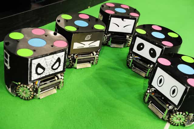 Some give numbers, others give faces to their small size soccer robots (from CSC Zhejiang University Hangzhou China), at RoboCup 2013 in Eindhoven (NL). (Photo by Bart van Overbeeke)