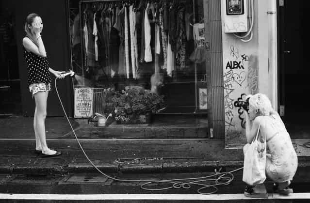 The blonde photographer (and her fleeting subject). Harajuku, 2012. (Davide Filippini)