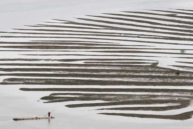 [Texture After A Low Tide]. This is one of the wonders of the sea at low tide, we can just imagined it was a peacock feather, and a boat adventures. Location: Qi Du, Xiapu, Fu Jian of China. (Photo and caption by Cheryl Tan/National Geographic Traveler Photo Contest)
