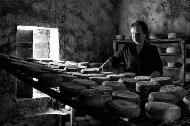[Say traditional cheese]. Up in the mountains, in a small village of Crete, Mrs Kalliopi keeps the tradition of making cheese alive. Time seems to stand still in this place to remind us how people worked and produced things without the means of technology. This is an old room made of stones, where cheese is preserved and matured in what they call [cage conditions]. Location: Geraki Crete Greece. (Photo and caption by Stella Meligounaki/National Geographic Traveler Photo Contest)