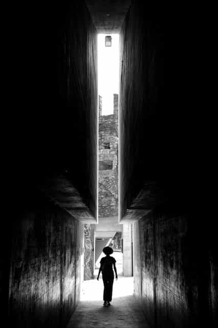 [The entrance of the castle]. I was visiting Castlegrande in Bellinzona, Switzerland, and when I entered the castle, I had a chance to look back and captured the moment my partner just walked into the tunnel of the castle. I was amazed at the unique structure of the tunnel entrance and the mysterious atmosphere created by the light shedding from behind. (Photo and caption by Po Chun Hsu/National Geographic Traveler Photo Contest)