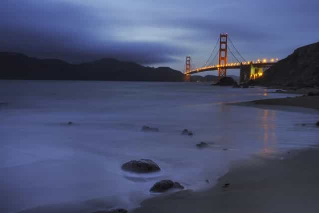 [Golden & Blue Hues]. Shot during twilight at Marshal Beach with the Golden Gate bridge at the background which had just been lit up. Location: San Francisco, USA. (Photo and caption by Suvendu Das/National Geographic Traveler Photo Contest)