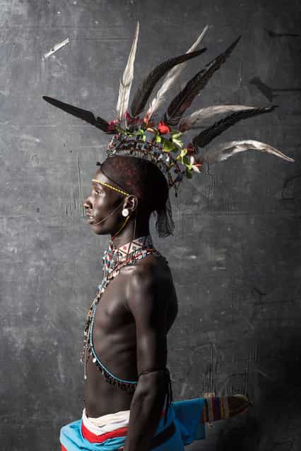 [Samburu Warrior]. A young warrior of the Samburu Tribe in Kenya in his striking traditional clothing. Strong, proud, confident, fierce, stoic. He was absolutely exquisite. Location: South Horr, Kenya. (Photo and caption by Tierney Farrell/National Geographic Traveler Photo Contest)