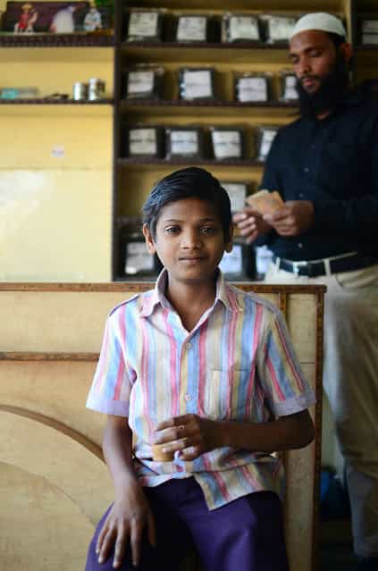 [Now, We Drink Chai]. No trip to India is complete without an aromatic cup of Chai Masala. But for me, this was an experience to remember. After discussing life with the store owner and eventually walking away with a few packets of Jodhpur's finest chai, this young boy offered my a cup of delicious hot chai. He then sat down across from me and said [Now, we drink chai]. (Photo and caption by Justin Pearson/National Geographic Traveler Photo Contest)