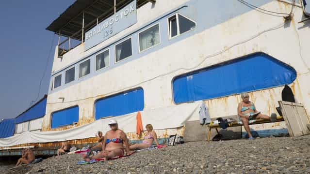 [Russians sun bathing in Vladivostok]. Surpising! 22°C in Vladivostok in October. People enjoy themselves on Russian beaches across from Japan. (Photo and caption by Eve Van Soens/National Geographic Traveler Photo Contest)