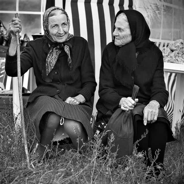 [The Mark of Time]. Two elder women from the village Stoilovo sit down to enjoy the festivities at the annual Zelenika Festival that takes place in the Strandja mountains just outside of Stoilovo. The festival celebrates the flowering of the Strandja Zelenika, a plant that is indigenous to the Strandja mountains. Location: Stoilovo, Bulgaria. (Photo and caption by Daniel Scott/National Geographic Traveler Photo Contest)