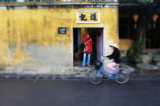 [Hoi An, Vietnam]. I captured this photo of my girlfriend as she paused exiting a shrine. Among the hustle and bustle of Vietnam. (Photo and caption by David Elmore/National Geographic Traveler Photo Contest)