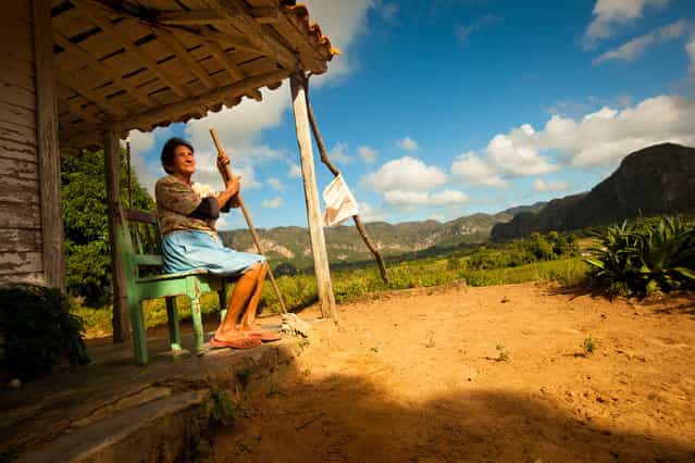 [Devotion to the Land]. Dora and her husband are farmers living in the ancient valley of Vinales in northwest Cuba. This valley is studded with ancient limestone pillars called mogotes that stand like guardians over the fertile fields of tobacco and corn. (Photo and caption by James Kao/National Geographic Traveler Photo Contest)