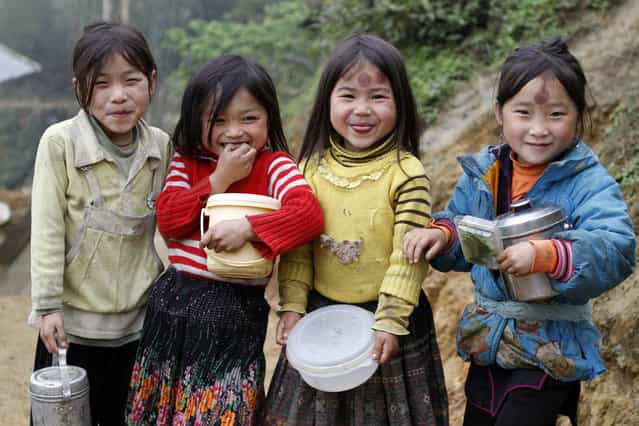 [Kids of Sapa]. Four little beautiful Hmong girls from Lao Chai Village, near Sapa, Vietnam. (Photo and caption by Felipe Hanower/National Geographic Traveler Photo Contest)