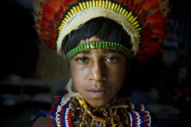 [Vegu Nagamiufa]. Vegu, a member of the Nagamiufa tribe, in the Eastern Highlands of Papua New Guinea wearing traditional [bilas]. Her grandfather recieves a small living allowance from the government for his work preserving traditional costumes of tribal groups in the highlands. (Photo and caption by James Morgan/National Geographic Traveler Photo Contest)
