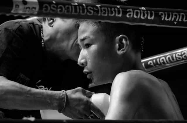 [Muay Thai Fighter]. I attended a Muay Thi Fight while traveling through Bangkok. The first round was of two boys that looked like they were no older than 15. They were ferocious and I couldn't believe how intense the fighting was. This is a picture of one of the fighters towards the end of the fight when he looks to be exhausted from all the blows he's taken. (Photo and caption by James Keefe/National Geographic Traveler Photo Contest)