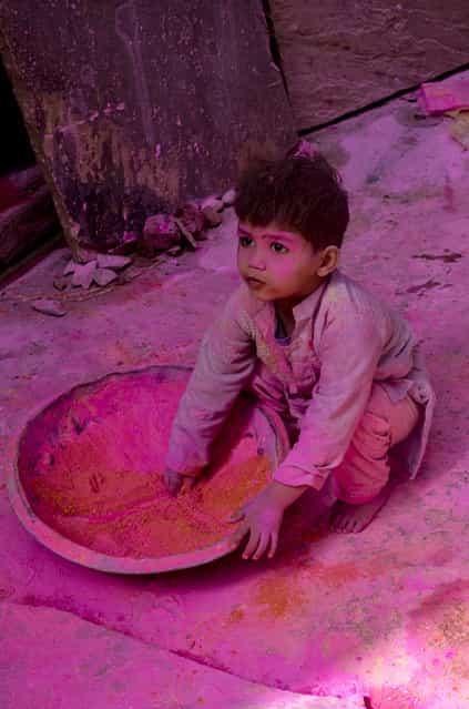 [Child playing with color]. This child was playing Holi festival of color. Location: Vrindavan, India. (Photo and caption by Anirudha Robi Chakraborty/National Geographic Traveler Photo Contest)