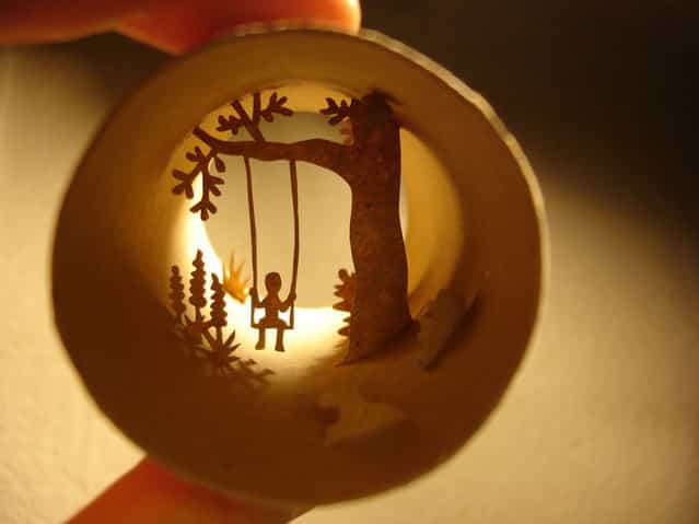 Tiolet paper roll art of a child on a tree swing. (Photo by Anastassia Elias/Caters News)