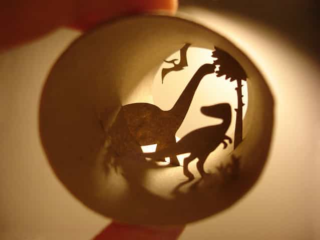 Toilet paper roll art of prehistoric earth with dinosaurs. (Photo by Anastassia Elias/Caters News)