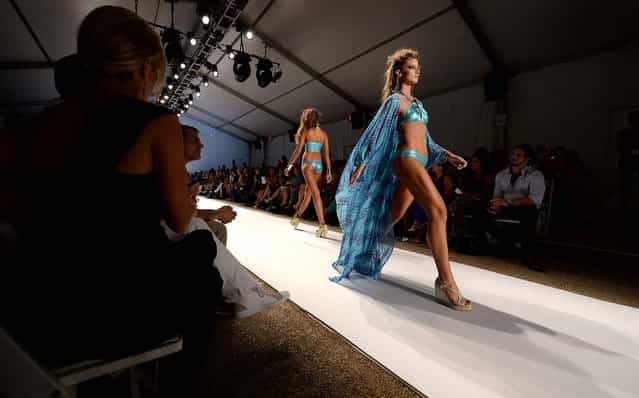 Models walk the runway at the Dolores Cortes. (Photo by Andrew H. Walker/Getty Images for Mercedes-Benz Fashion Week Swim 2014)